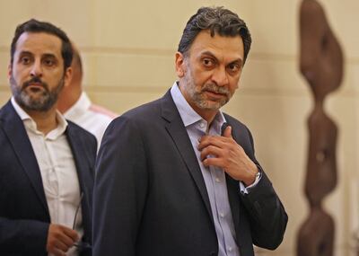 Lebanese MP Ibrahim Mneimeh, right, and Michel Douaihy arrive in parliament in Beirut in May. AFP