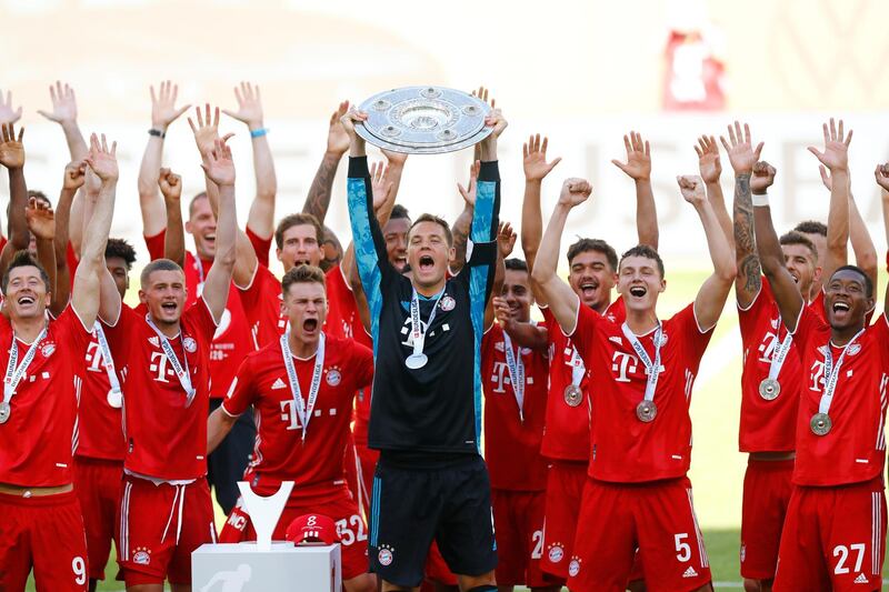 Bayern Munich's Manuel Neuer celebrates with teammates after winning the Bundesliga, on Saturday, June 27. Bayern had just thrashed Wolfsburg 4-0. Reuters