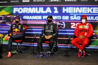 Valtteri Bottas, Max Verstappen and Carlos Sainz attend a press conference after obtaining the first, second and third positions for the Brazil Grand Prix. AFP
