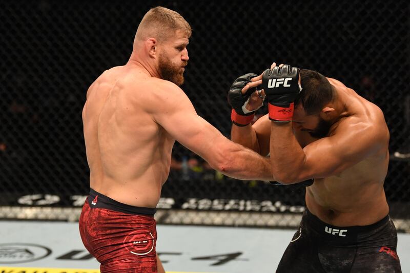 Jan Blachowicz punches Dominick Reyes in their light heavyweight championship bout during UFC 253 in Abu Dhabi, United Arab Emirates. Josh Hedges / Zuffa LLC