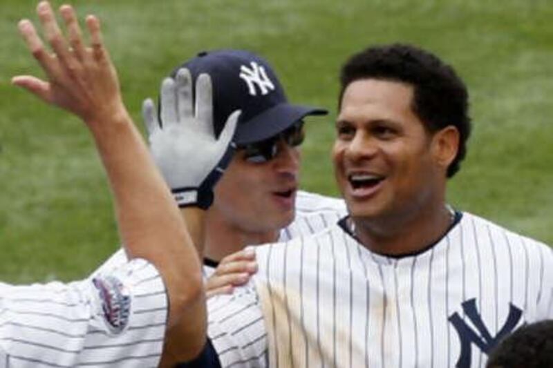 The New York Yankees  Bobby Abreu (right) celebrates with teammates after the win over the Tampa Bay Rays.