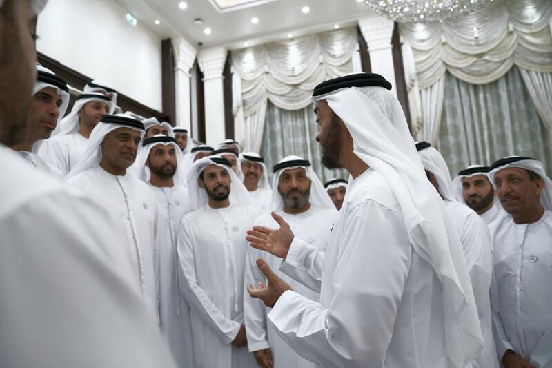 ABU DHABI, UNITED ARAB EMIRATES - May 21, 2018: HH Sheikh Mohamed bin Zayed Al Nahyan Crown Prince of Abu Dhabi Deputy Supreme Commander of the UAE Armed Forces (C), speaks with General Authority of Islamic Affairs and Endowments employees during an iftar reaction at Al Bateen Palace. Seen with HE Dr Mohamed Matar Salem bin Abid Al Kaabi, Chairman of the UAE General Authority of Islamic Affairs and Endowments (back C) . 

( Hamad Al Kaabi / Crown Prince Court - Abu Dhabi )
---