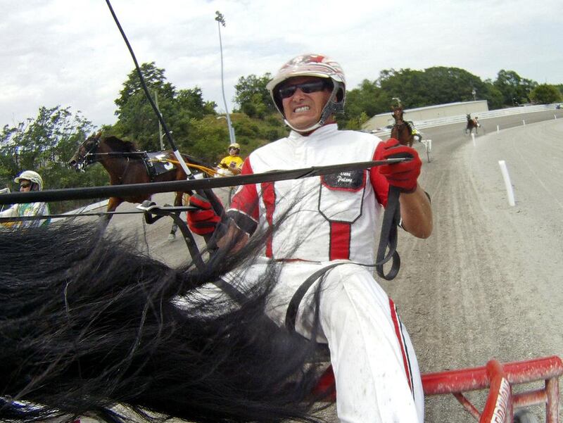 A GoPro camera records harness racing driver Dave Palone come down the stretch for a win to set the all-time North American career win record of 15,181 on July 5, 2012. Mark Hall / AP Photo