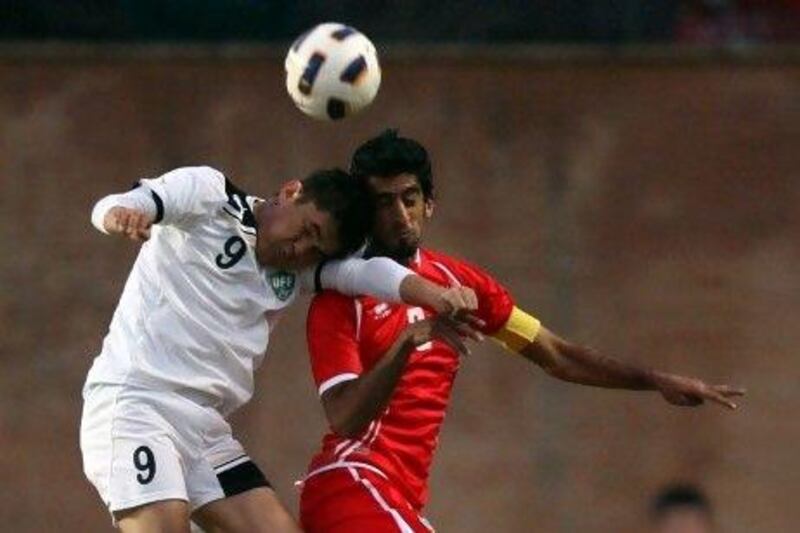 Hamdan Al Kamali, right, on loan from Al Wahda to French club Lyon, has inspired his UAE teammates to perform on the big stage. The captain called their win over Uzbekistan the best in his career. Sammy Dallal / The National