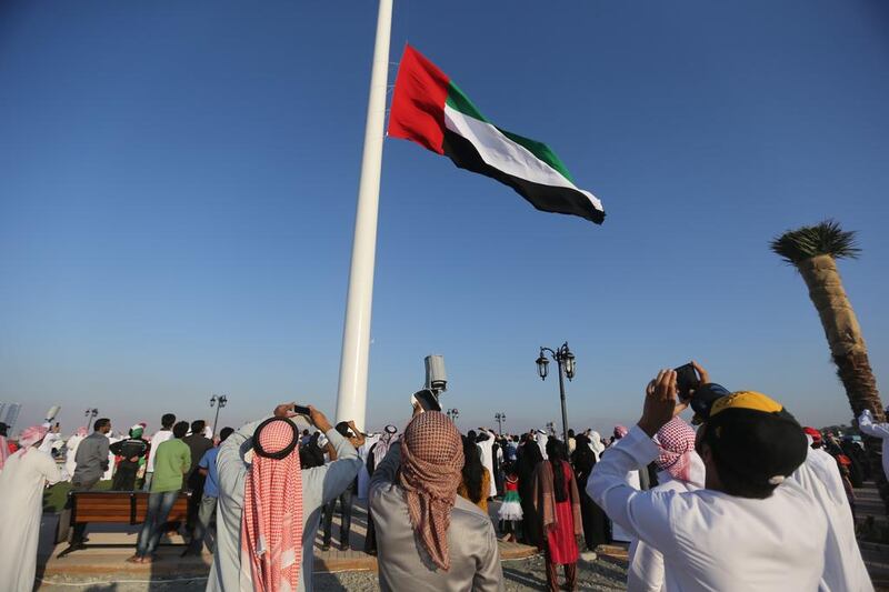 A large UAE flag is hoisted as Ras al Khaimah celebrates UAE’s National Day. Sammy Dallal / The National