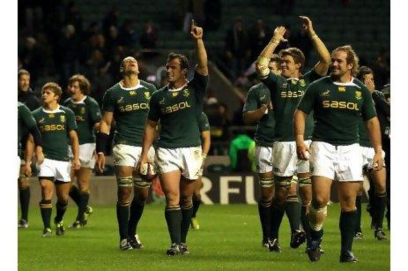 Bismarck du Plessis, centre, leads the South African celebrations at Twickenham.