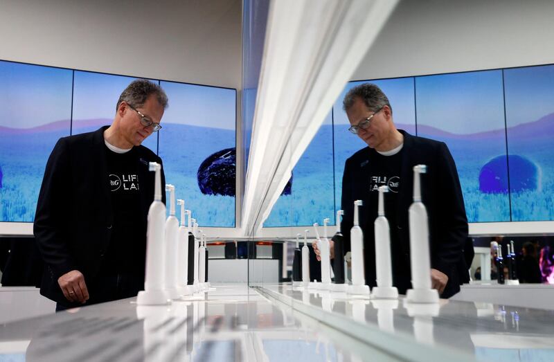 Hansjoerg Reick looks at a display of Oral-B Genius X smart toothbrushes. AP Photo