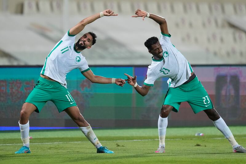 Saudi Arabia's Abdullah Alkhainari, left, and Mohammed Kanno celebrate Saleh Al Shehri's opening goal. AP