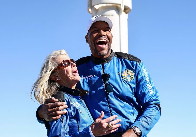 "Good Morning America" host and former NFL star Michael Strahan laughs with Laura Shepard Churchley, daughter of astronaut Alan Shepard, during a media availability on the landing pad after they flew into space aboard Blue Origin’s New Shepard on December 11, 2021 near Van Horn, Texas. Getty Images / AFP
