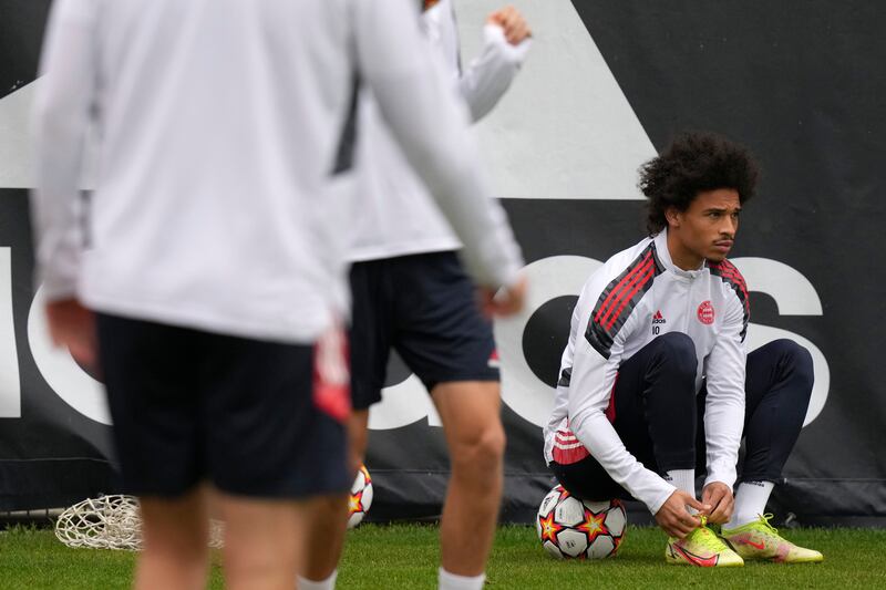 Bayern Munich's Leroy Sane ties his laces. AP Photo