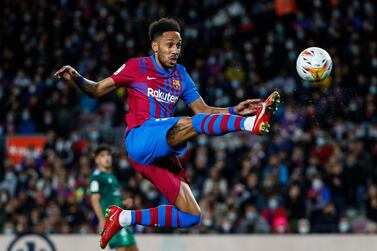 Barcelona's Pierre-Emerick Aubameyang controls the ball during a Spanish La Liga soccer match between FC Barcelona and Osasuna at the Camp Nou stadium in Barcelona, Spain, Sunday, March 13, 2022.  (AP Photo / Joan Monfort)