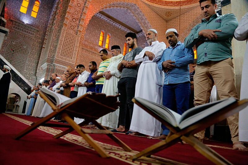 Muslims attend prayers on the first day of Eid in Baghdad, Iraq. Karim Kadim / AP Photo