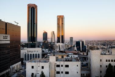 The headquarters of Arab Bank Plc, left, and Al Abdali district sits on the city skyline as the sun sets in Amman, Jordan, on Thursday, June 21, 2018. President Trump and First Lady Melania Trump will host Jordans King Abdullah and Queen Rania at the White House on June 25. Photographer: Annie Sakkab/Bloomberg via Getty Images