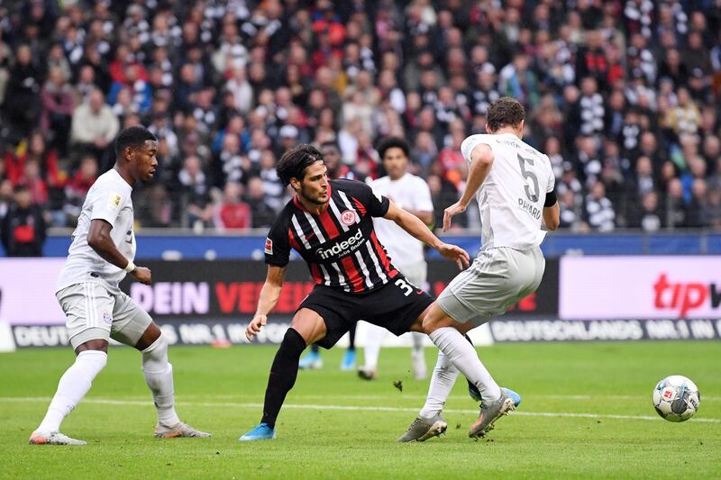 FRANKFURT AM MAIN, GERMANY - NOVEMBER 02: Goncalo Paciencia of Frankfurt is challenged by Benjamin Pavard and David Alaba of Muenchen during the Bundesliga match between Eintracht Frankfurt and FC Bayern Muenchen at Commerzbank-Arena on November 02, 2019 in Frankfurt am Main, Germany. (Photo by Alex Grimm/Bongarts/Getty Images)