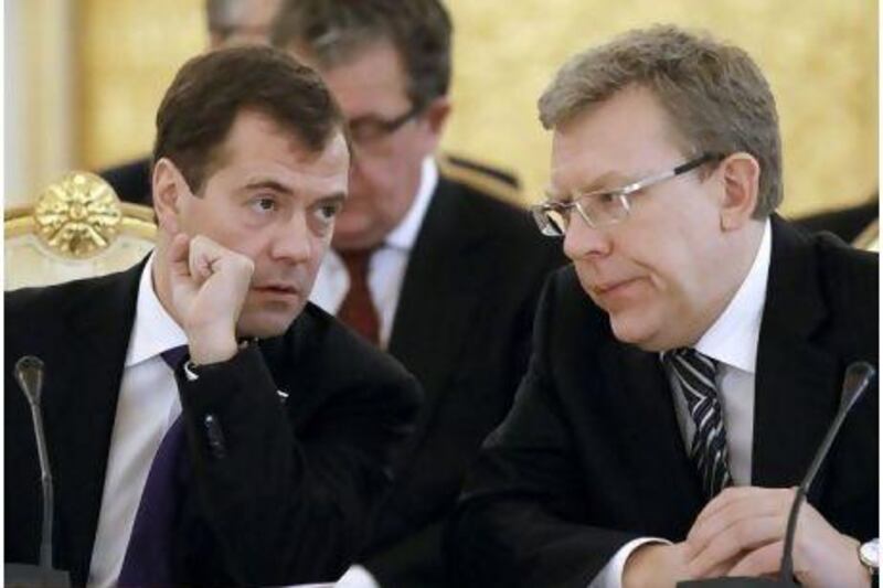 Russia's president, Dmitry Medvedev, left, and finance minister Alexei Kudrin, who has resigned after a televised confrontation with Medvedev. AP Photo /RIA Novosti, Dmitry Astakhov, Presidential Press Service