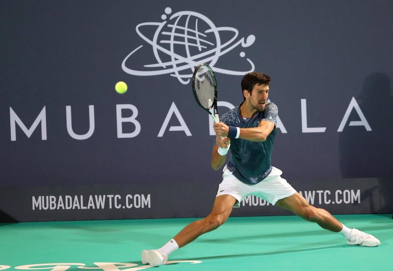 Novak Djokovic returns a shot against Karen Khachanov during their Mubadala World Tennis Championship match at Zayed Sports City. Reuters
