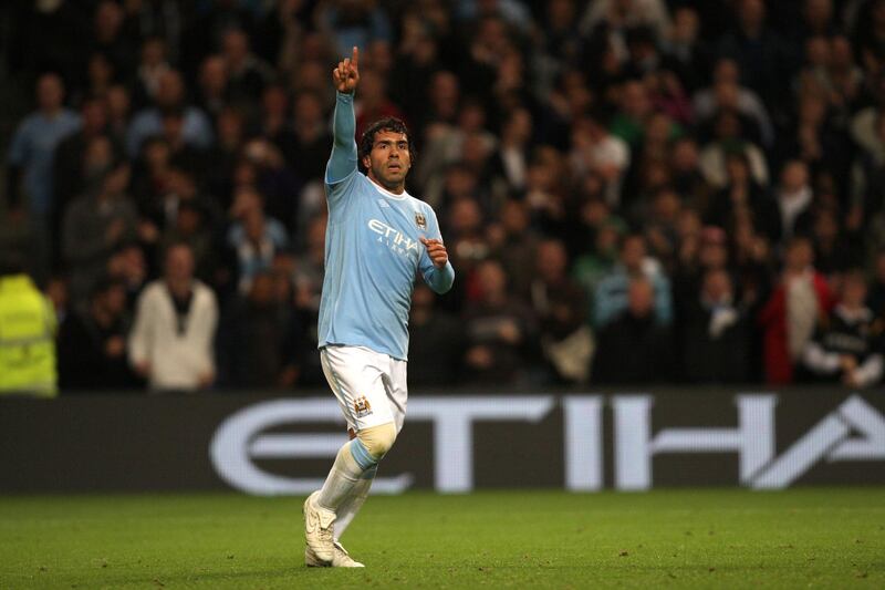 Carlos Tevez of Manchester City celebrates after scoring to make it 3-1 (Photo by AMA/Corbis via Getty Images)