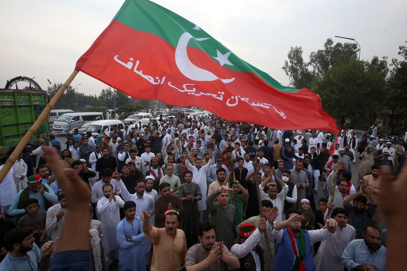 Blockading a motorway during a PTI protest in Peshawar. AP