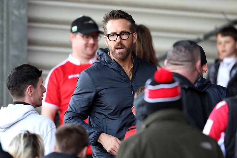 Ryan Reynolds, co-owner of Wrexham, interacts with fans during the Vanarama National League match between against Notts County at The Racecourse Ground. Getty Images