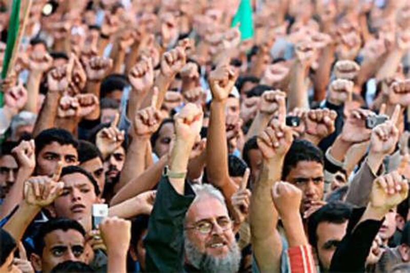 Palestinians take part in a rally to protest the arrest of Hamas members by the security forces loyal to Palestinian President Mahmoud Abbas.