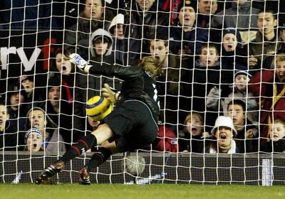 Manchester United's goalkeeper Carroll grabs for the ball during the game against Tottenham Hotspur in their English Premier league match at Old Trafford.  Manchester United's goalkeeper Roy Carroll grabs for the ball from a shot from Tottenham's Miguel Pedro Mendes in their English Premier league soccer match at Old Trafford, Manchester, January 4, 2005. The match finished 0-0 with the shot from Tottenham's Mendes not being given as a goal after the ball crossed the line. NO ONLINE/INTERNET USAGE WITHOUT FAPL LICENCE. FOR DETAILS SEE WWW.FAPLWEB.COM REUTERS/Ian Hodgson