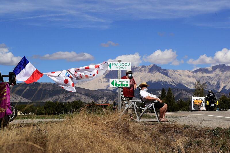 Spectators wait for the peloton during Stage 4. EPA