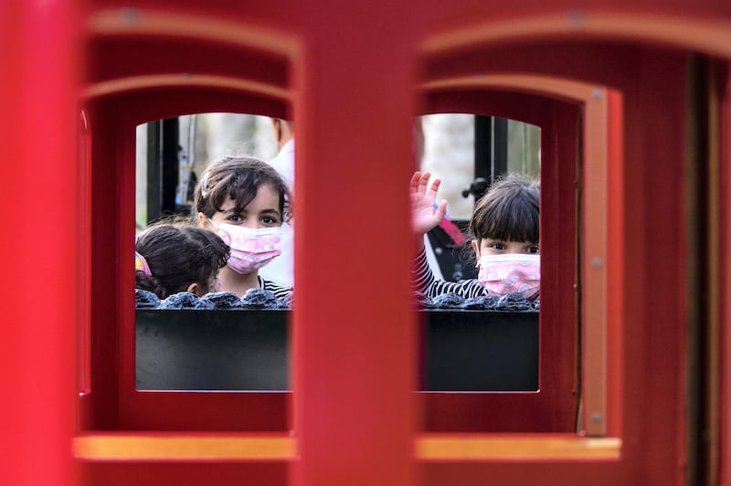 Abu Dhabi, United Arab Emirates, March 15, 2021.  Emirati Children's Day at Umm Al Emarat Park.  The Al Yaqoubi sistersride the train at the park.Victor Besa/The NationalSection:  NAFOR:  Stand Alone/ Big Picture