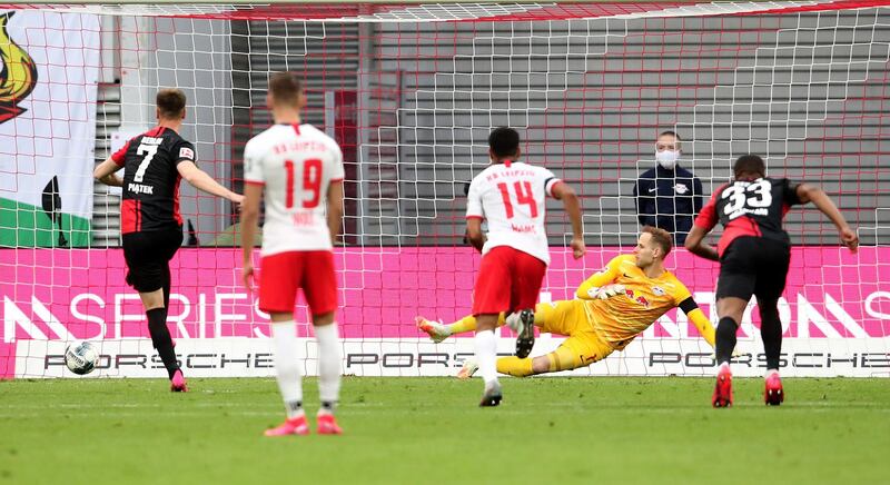 Hertha Berlin's  Krzysztof Piatek fires home from the spot to make it 2-2. Getty