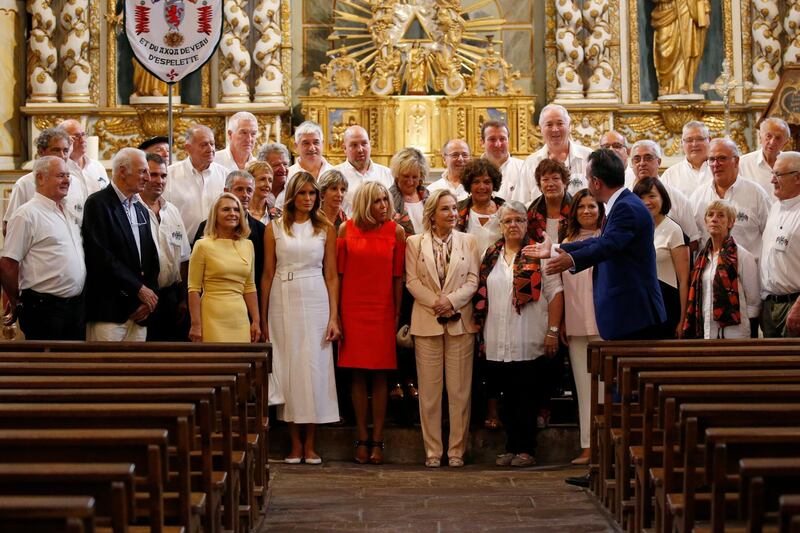 Brigitte Macron, wife of French President Emmanuel Macron, U.S. First Lady Melania Trump , Akie Abe, wife of Japan's Prime Minister Shinzo Abe, Chile's First Lady Cecilia Morel, Jenny Morrison, wife of Australia's Prime Minister Scott Morrison, and Malgorzata Tusk, wife of European Council President Donald Tusk visit a church in Espelette, near Biarritz, southwestern France.  AP