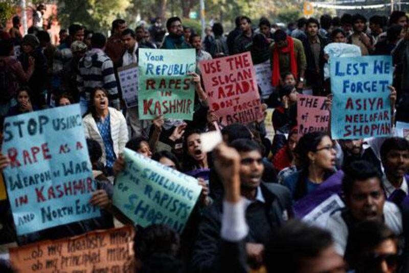 Indians participate in a protest against gender discrimination and sexual violence in New Delhi on Saturday. Altaf Qadri / AP Photo