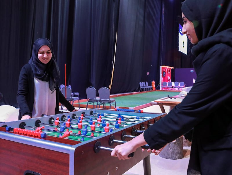 Abu Dhabi, U.A.E., May 30, 2018.  Ramadan Exhibition at ADNEC.  Visitors enjoy a game of foosball.
Victor Besa / The National
Reporter:  Saeed Saeed
Section:  Arts & Culture