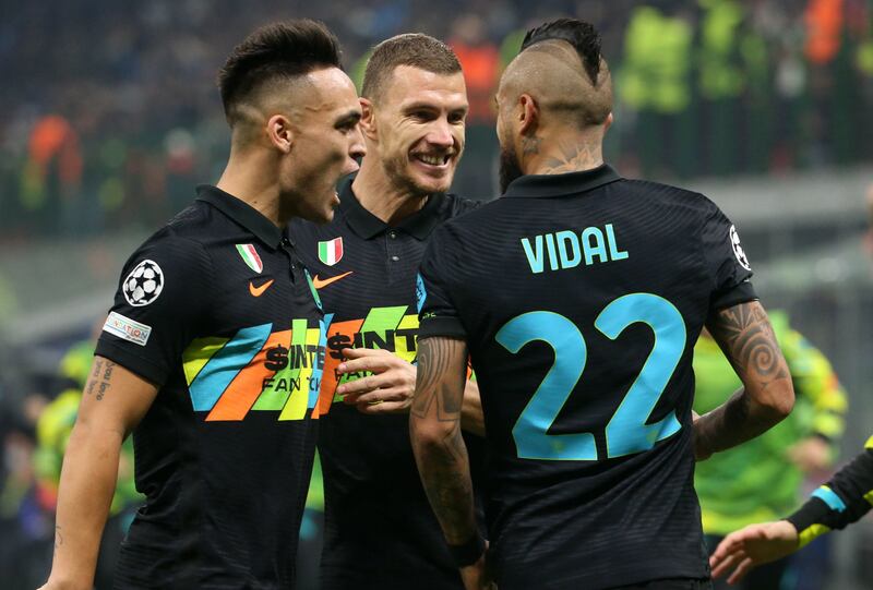Lautaro Martinez celebrates with Arturo Vidal and Edin Dzeko after Vidal's goal against Sheriff Tiraspol in the Champions League. EPA