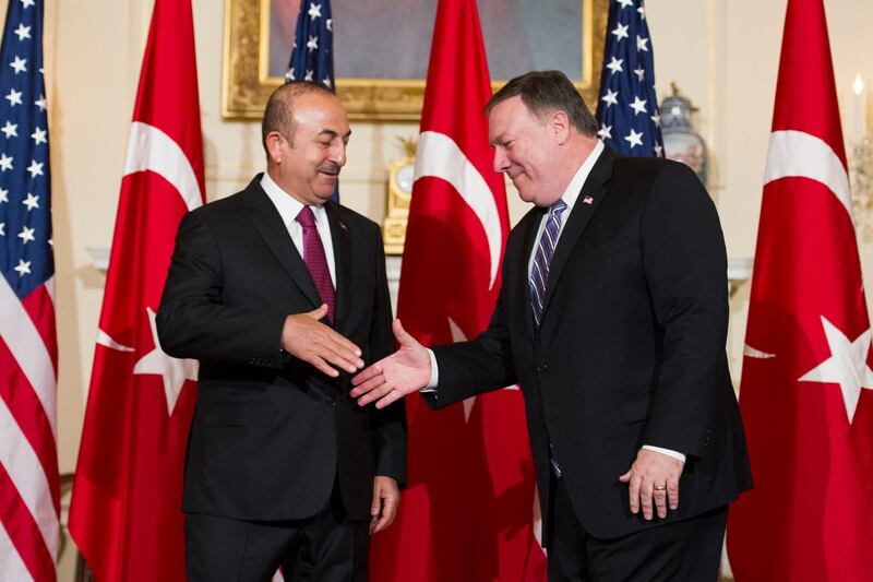 Secretary of State Mike Pompeo, right, meets with Turkish Foreign Minister Mevlut Cavusoglu at the State Department in Washington, Monday, June 4, 2018. (AP Photo/Cliff Owen)