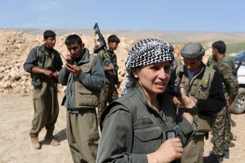 Kurdistan Workers Party (PKK) fighters prepare to join others near a position in Sinjar, Iraq. Asmaa Waguih / Reuters

