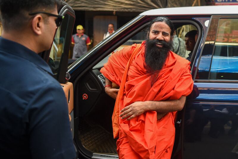 Yoga guru Ramdev arrives for the contempt hearing a the Indian Supreme Court. AFP