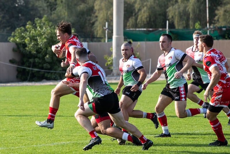 Charlie Taylor of Dubai Tigers attempts to break free from a tackle.