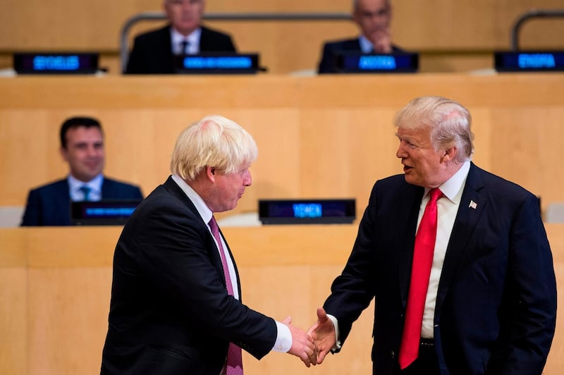 (FILES) In this file photo taken on September 18, 2017 British Foreign Secretary Boris Johnson (L) and US President Donald Trump greet before a meeting on United Nations Reform at UN headquarters in New York on September 18, 2017. Prime Minister Boris Johnson makes his debut on the global stage at the G7 summit this weekend, August 24, 2019, where all eyes will be on his chumminess with US President Donald Trump.
 / AFP / Brendan Smialowski
