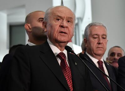 Devlet Bahceli, leader of Nationalist Movement Party, or MHP, and the main ally of Turkey's President Recep Tayyip Erdogan, speaks to the media at his party's headquarters in Ankara, Turkey, late Sunday, June 24, 2018. Erdogan has claimed victory in critical elections based on unofficial results, securing an executive presidency with sweeping powers. (MHP Press Service via AP)