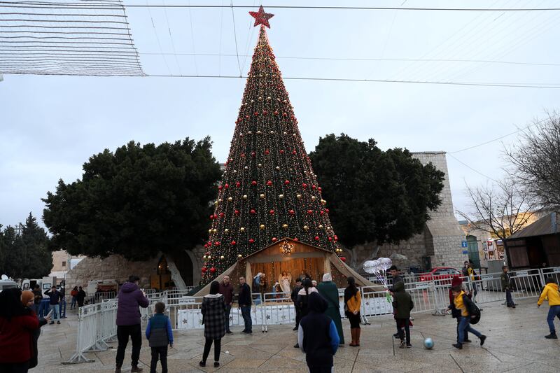 A Christmas tree decorates Manger Square, next to the Church of the Nativity. EPA