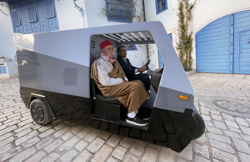 Boubaker Siala, founder and CEO of Tunisian-German start-up Bako Motors, drives the three-wheeled solar electric car along a street in Sidi Bou Said, Tunisia. All photos: Reuters