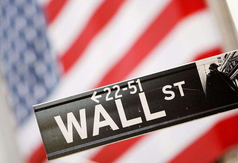 FILE PHOTO: A Wall Street sign is seen outside the New York Stock Exchange, September 30, 2008.  REUTERS/Lucas Jackson/File Photo