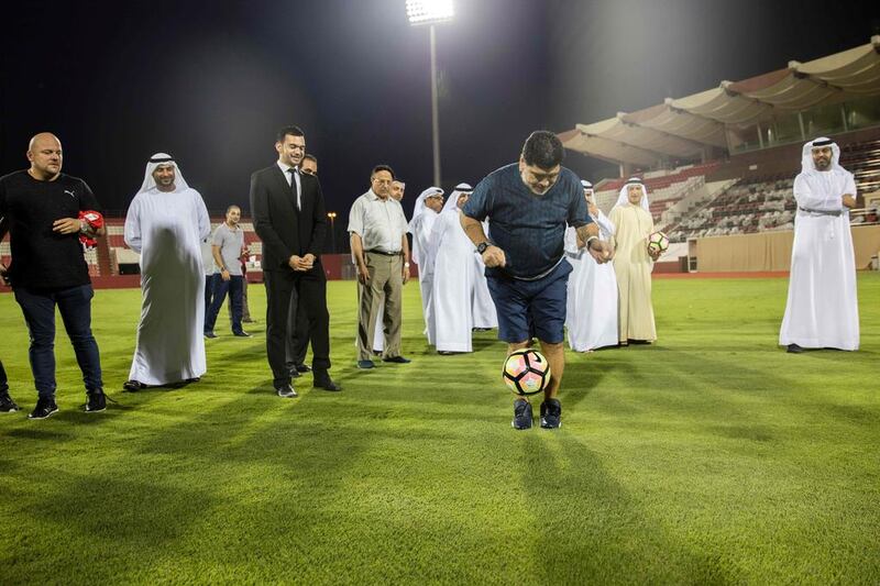 Diego Maradona shows off some skills at Al Fujairah stadium after being announced as the new head coach of the second division side. AFP