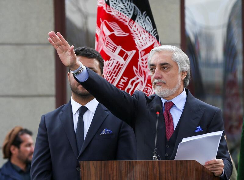 Afghanistan's former CEO Abdullah Abdullah gestures during a parallel swearing-in ceremony also in Kabul. Reuters
