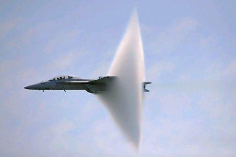 A ring of water vapour is created as an F/A-18F Super Hornet flies close to breaking the sound barrier. Christopher Pasatieri / Reuters