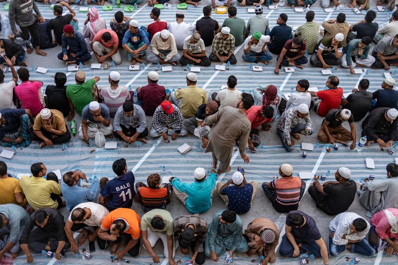People wait for sunset to break their fast with iftar at Al Ta'Awun Mosque in Al Quoz. Antonie Robertson / The National