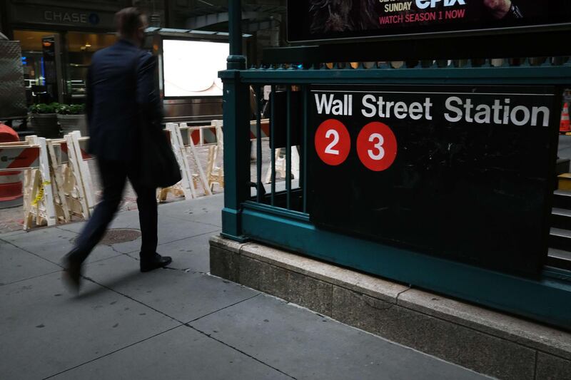 NEW YORK, NEW YORK - OCTOBER 02: People walk near the New York Stock Exchange (NYSE) in lower Manhattan on on October 02, 2020 in New York City. Stocks and markets around the world have fallen in morning trading as investors digest the overnight news that President Donald Trump has Covid-19.   Spencer Platt/Getty Images/AFP
== FOR NEWSPAPERS, INTERNET, TELCOS & TELEVISION USE ONLY ==
