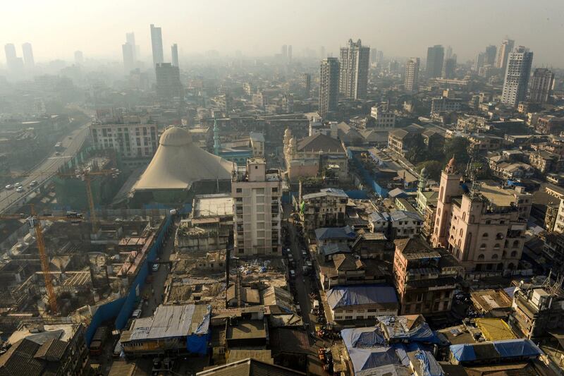 This photo taken on December 2, 2016 shows a general view of the Bhendi Bazaar area in Mumbai that is being redeveloped under the Cluster Development Act 2009 by the Saifee Burhani Upliftment Trust.
Six hundred million dollars is being spent to demolish hundreds of rundown low-rise buildings in the dirty colonial-era market in Mumbai's historic Bhendi Bazaar and replace them with shiny skyscrapers that will house 20,000 Dawoodi Bohras, a sect of Shia Muslims, who have made the area their home for decades. / AFP PHOTO / Indranil MUKHERJEE / TO GO WITH India-religion-housing-heritage,FEATURE by Vishal MANVE