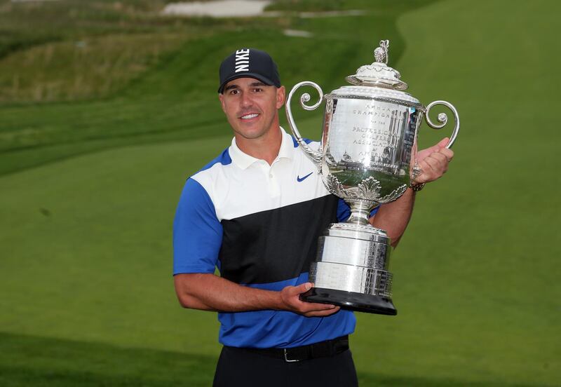 Brooks Koepka celebrates with the Wanamaker Trophy after winning the PGA Championship. USA Today