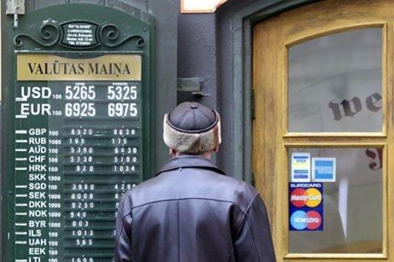 Currency rates are displayed near the exchange office in Riga. Latvia's economy grew by 5.5 per cent in 2011. Ints Kalnins / Reuters