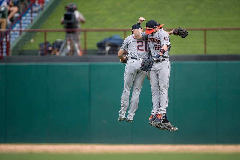 Aug 13, 2017; Arlington, TX, USA; Houston Astros left fielder Derek Fisher (21) and right fielder Josh Reddick (22) and center fielder Jake Marisnick (6) celebrate the win over the Texas Rangers at Globe Life Park in Arlington. The Astros defeat the Rangers 2-1. Mandatory Credit: Jerome Miron-USA TODAY Sports